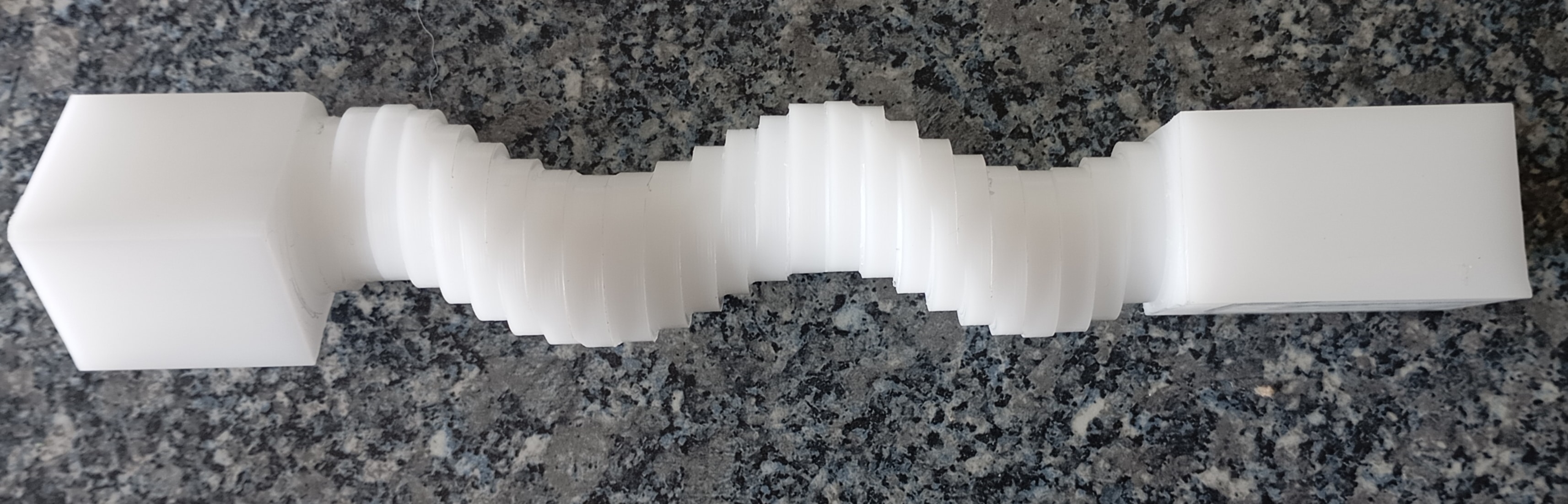 CNC lathe turning with coolant splash during precision metal machining